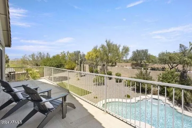 a view of a balcony with chairs