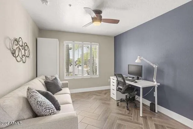 a living room with furniture and a window