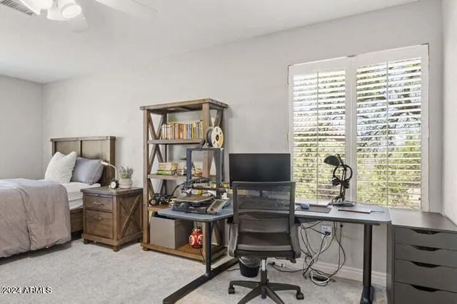 a room with a bed and a desk