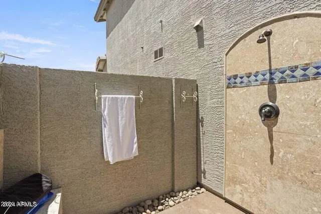 a swimming pool with outdoor seating and yard