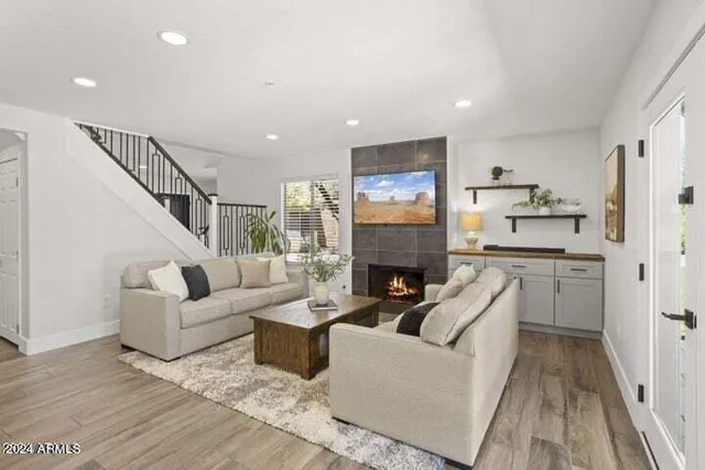 a living room with furniture and a fireplace