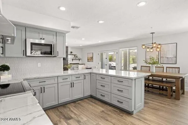 a large kitchen with cabinets