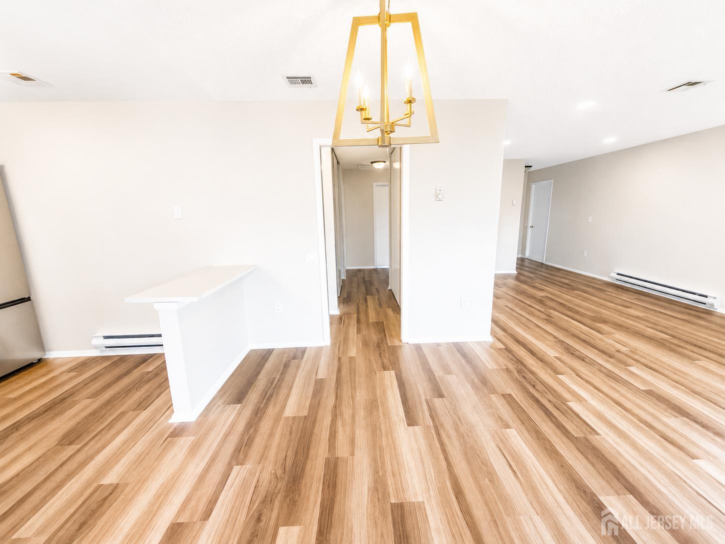 621 A Deal Road Monroe Township, NJ 08831 - Photo 6 of 27 a view of bedroom with wooden floor