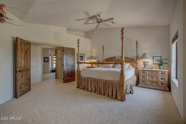 a bed room with furniture and a chandelier