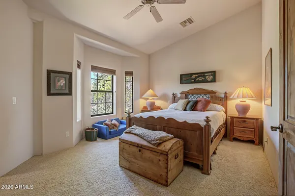 a bedroom with a bed and window