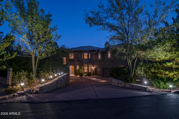 a front view of a house with yard