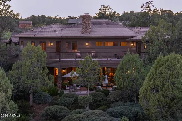 a view of house with outdoor space and garden