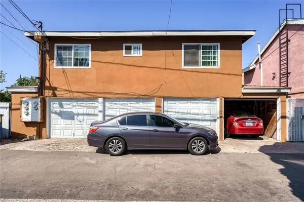 a view of a car parked in front of a house