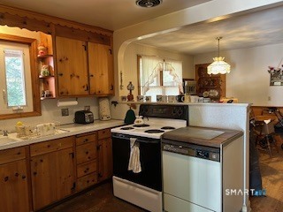 11 Edgewood Road Portland, CT 06480 - Photo 14 of 17 a kitchen with a stove and a sink