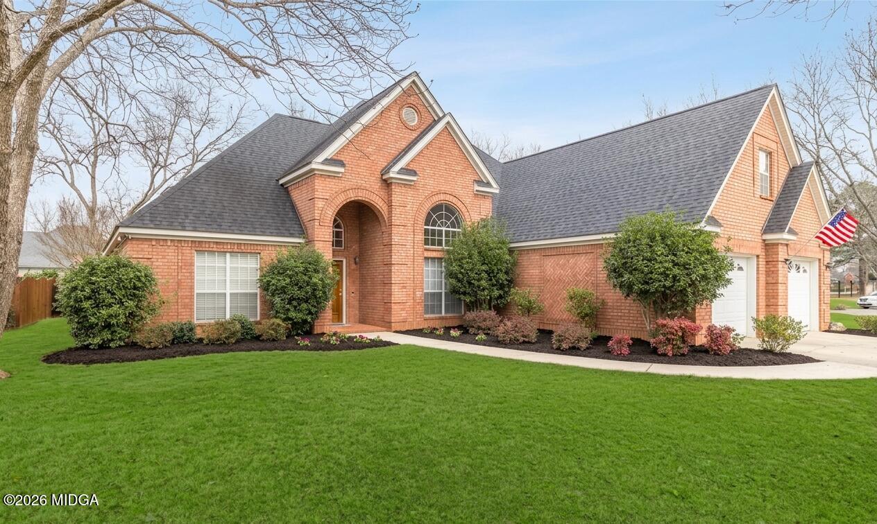 a front view of a house with a yard