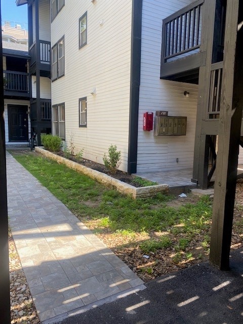 912 West 22 1/2 Street, Unit B Austin, TX 78705 - Photo 2 of 9 a front view of a house with a yard
