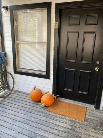 a view of entryway with wooden floor