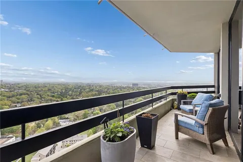 a view of a balcony with chairs