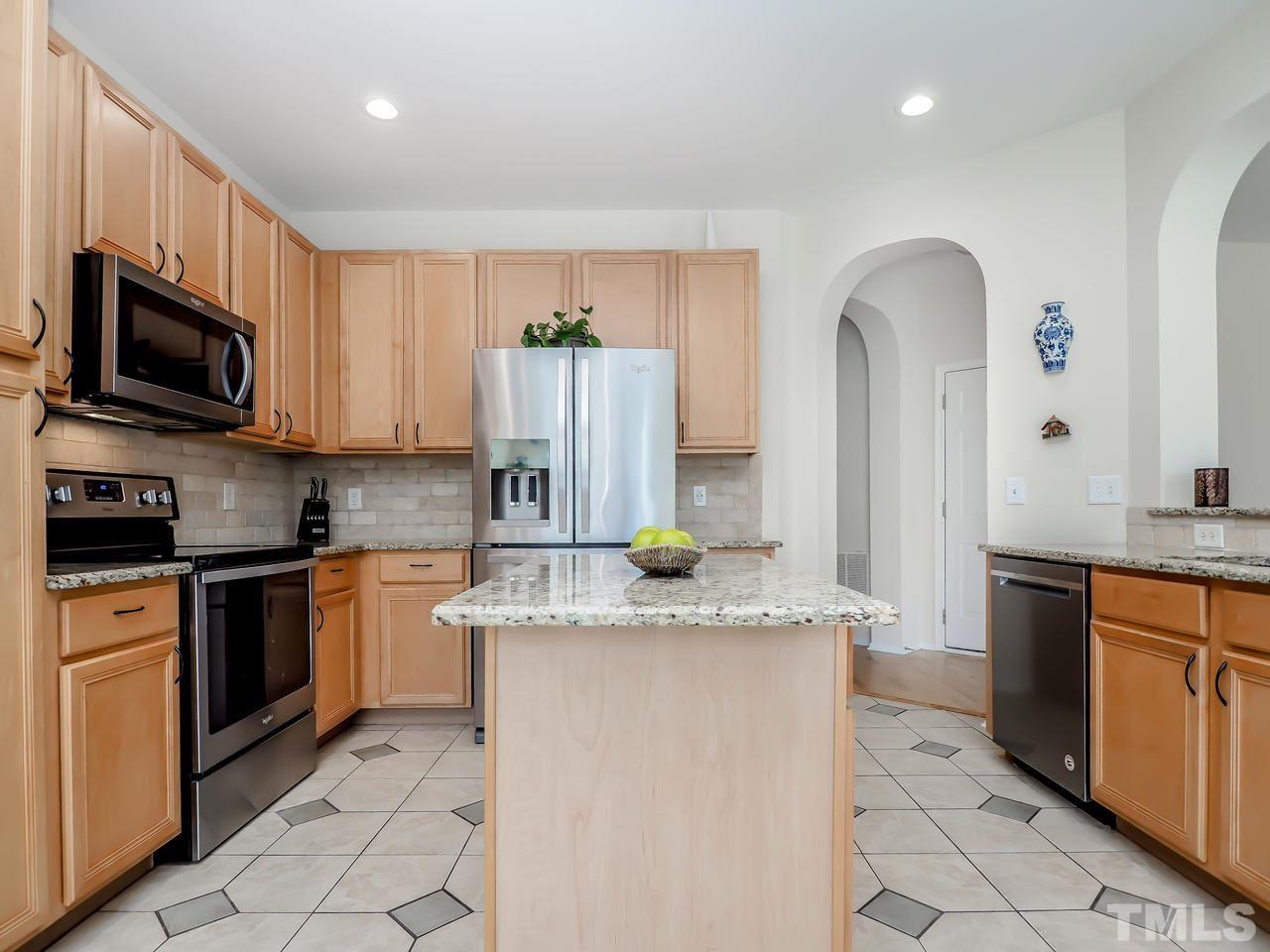 8507 Flying Buttress Drive Raleigh, NC 27613 - Photo 15 of 27 What a great working kitchen! Granite countertops, an island, stainless steel appliances and a great breakfast area with tons of natural light.