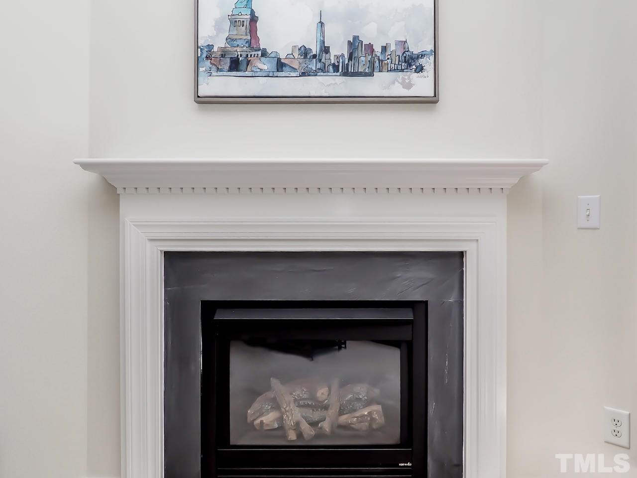 8507 Flying Buttress Drive Raleigh, NC 27613 - Photo 6 of 27 Corner fireplace fueled with natural gas