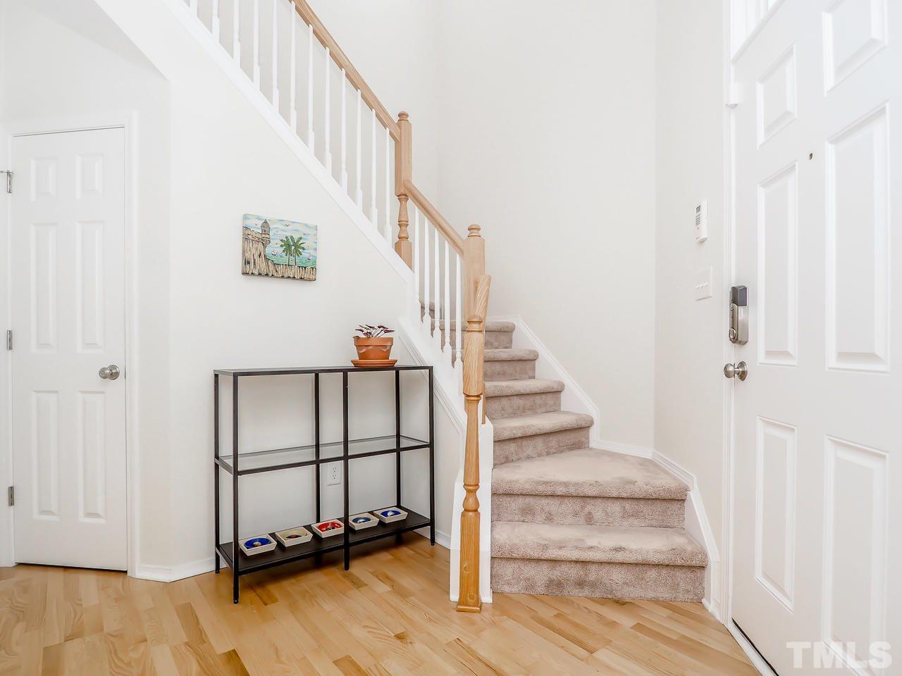 8507 Flying Buttress Drive Raleigh, NC 27613 - Photo 7 of 27 A dramatic 2-story foyer and entryway with hardwood floors