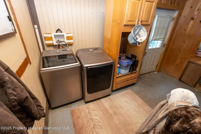 a living room with a fireplace furniture and a book shelf
