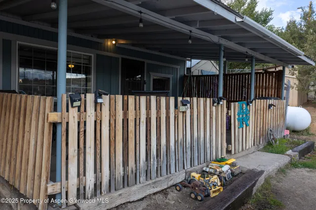 a view of a yard with an outdoor seating