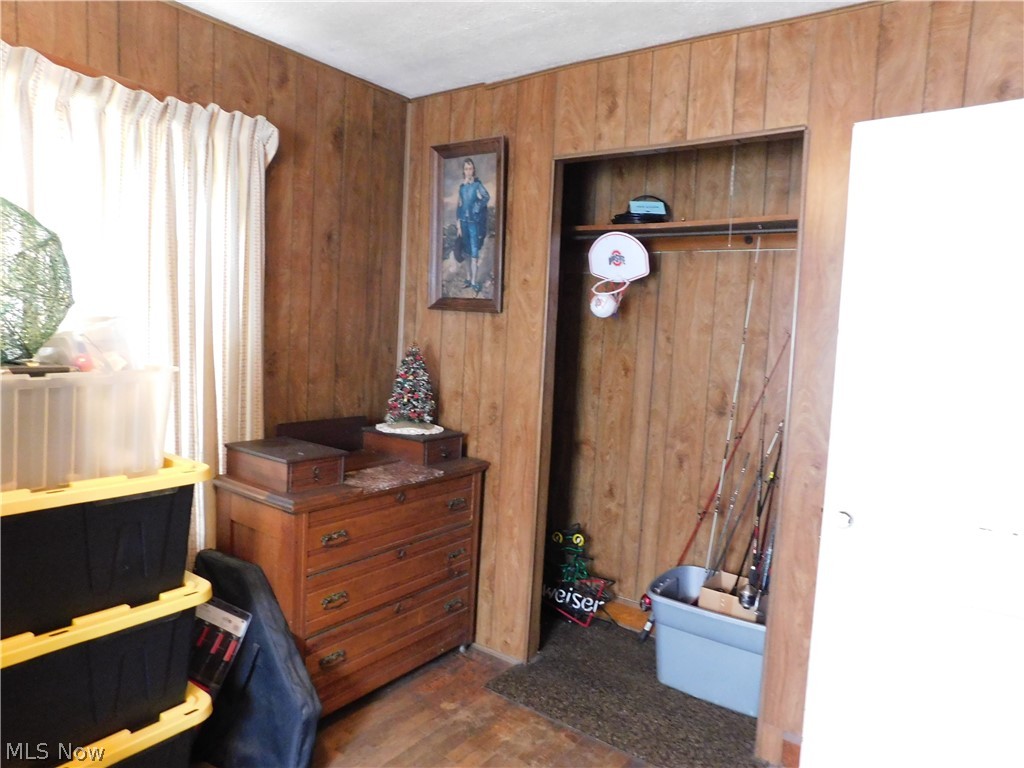 5531 Overton Road Wooster, OH 44691 - Photo 21 of 40 Bedroom with wood walls and a closet