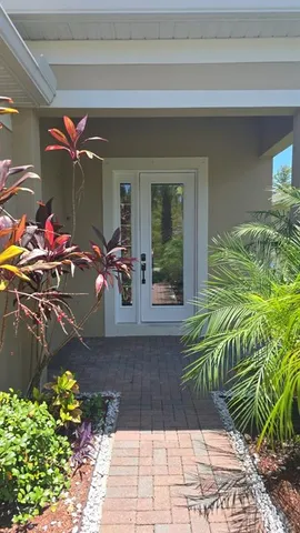 a view of a entryway with flower pots
