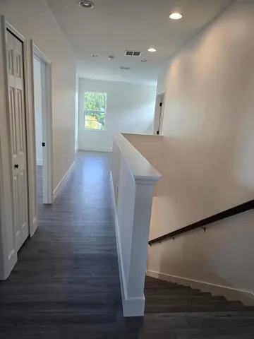 a view of entryway with wooden floor