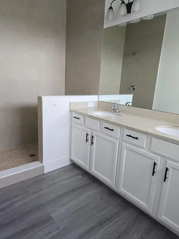 a room with a sink and a mirror