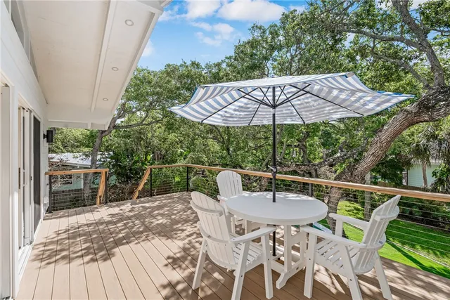 a patio with a table and chairs