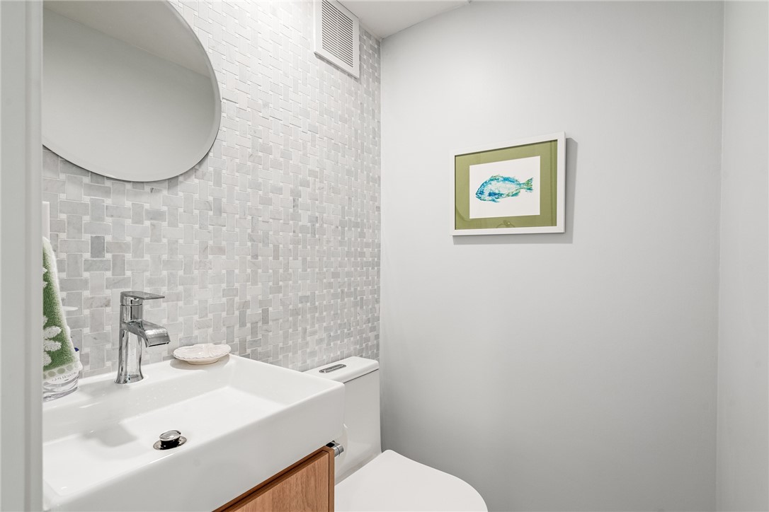 1881 Pebble Path Vero Beach, FL 32963 - Photo 19 of 34 a bathroom with a sink mirror and toilet