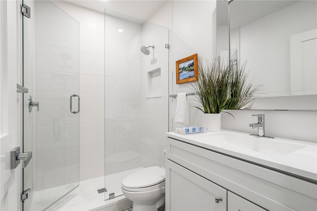 1881 Pebble Path Vero Beach, FL 32963 - Photo 20 of 34 a bathroom with a sink a toilet and shower