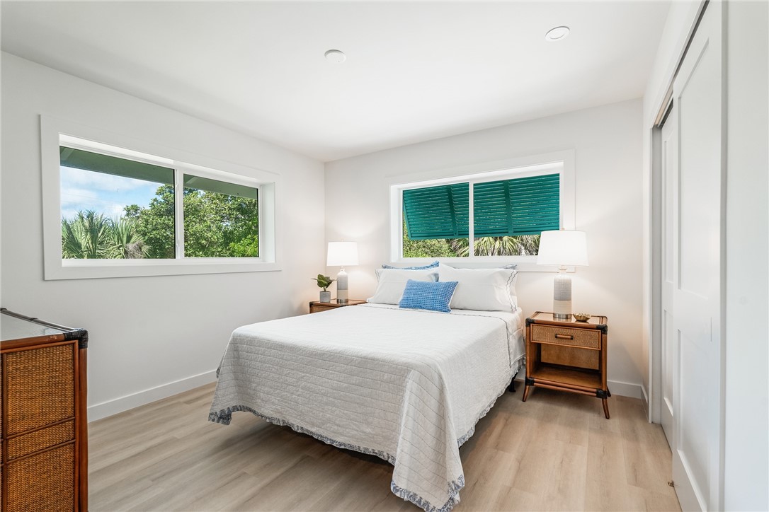 1881 Pebble Path Vero Beach, FL 32963 - Photo 23 of 34 a bedroom with a bed and a flat tv screen