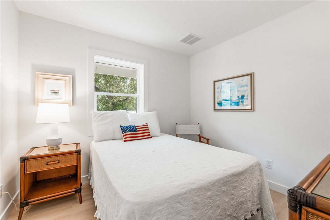 1881 Pebble Path Vero Beach, FL 32963 - Photo 25 of 34 a bedroom with a bed and wooden floor