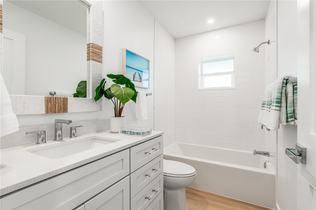 1881 Pebble Path Vero Beach, FL 32963 - Photo 27 of 34 a bathroom with a sink a toilet and shower