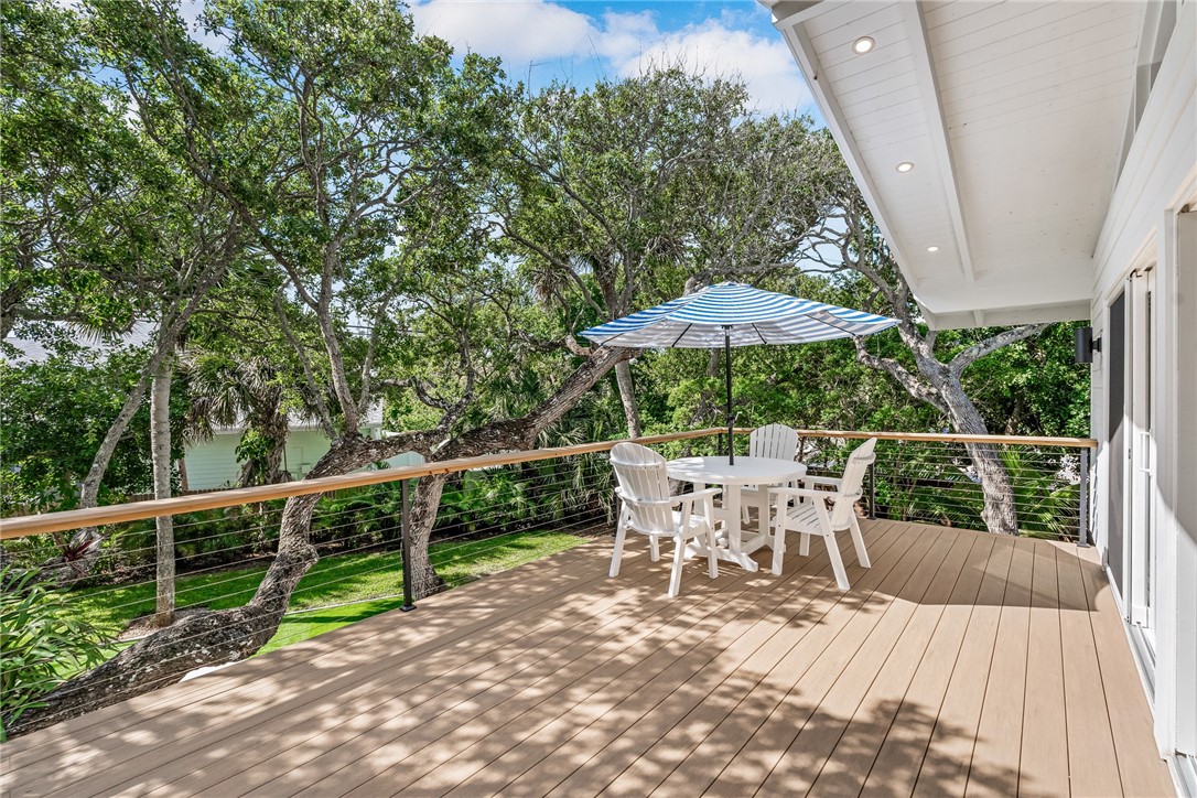 1881 Pebble Path Vero Beach, FL 32963 - Photo 28 of 34 a view of a patio with a table chairs and a wooden deck