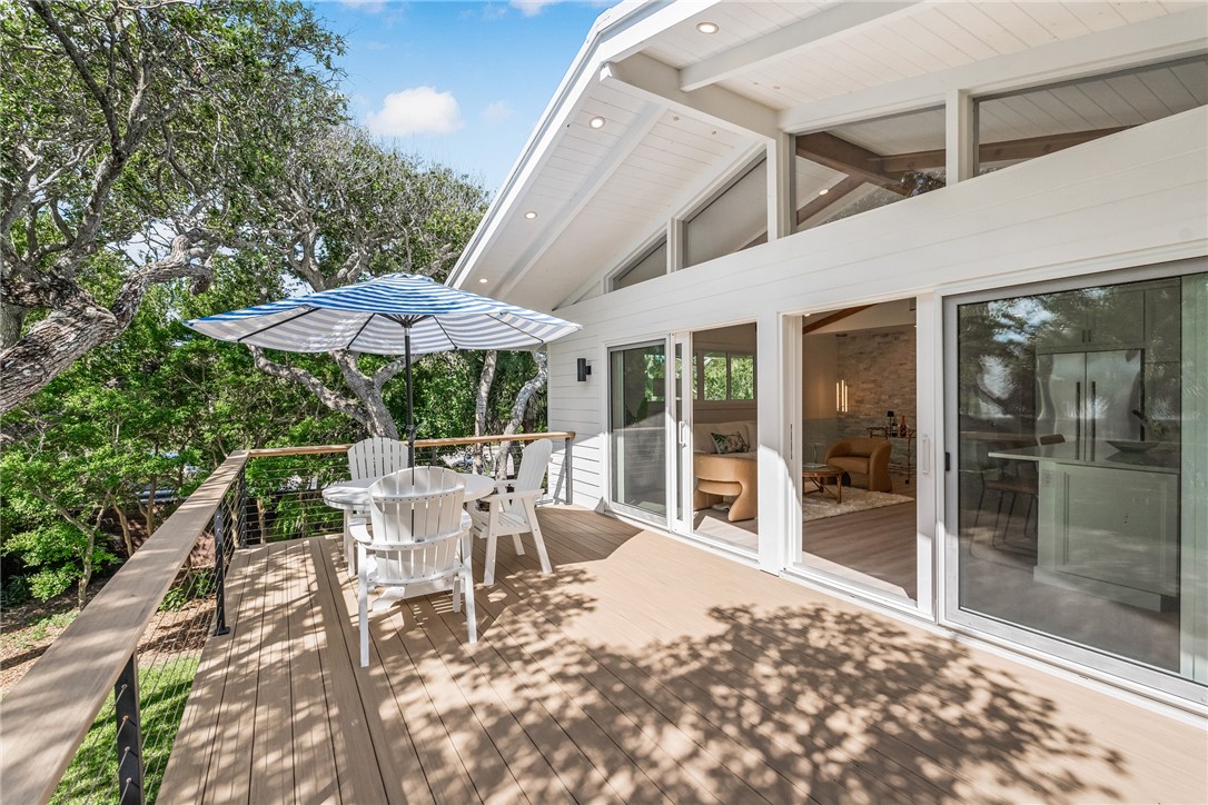 1881 Pebble Path Vero Beach, FL 32963 - Photo 5 of 34 a view of a patio with a table and chairs under an umbrella