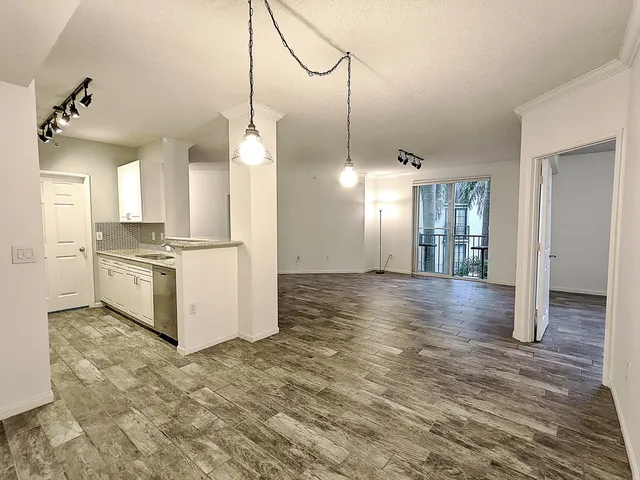 a view of a kitchen cabinets and wooden floor