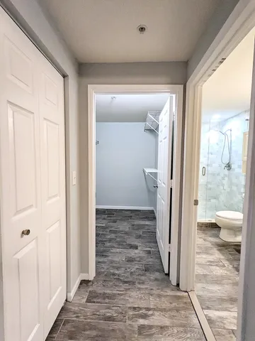 a view of a bathroom from a hallway