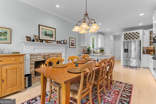 a kitchen with stainless steel appliances granite countertop a refrigerator a stove a sink and a microwave