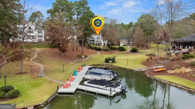 a view of a swimming pool with a fire pit and chairs