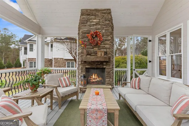 a outdoor living space with patio furniture and a fireplace