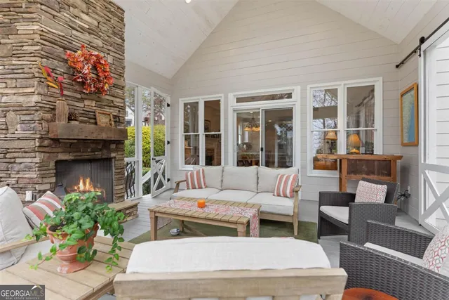a view of a a dining room with furniture window and wooden floor