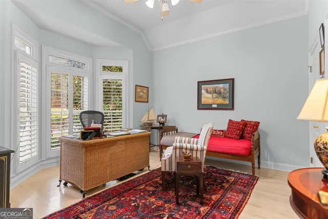 a bathroom with a granite countertop sink toilet and mirror