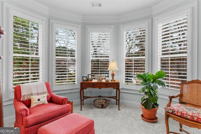 a view of room with window and cabinet