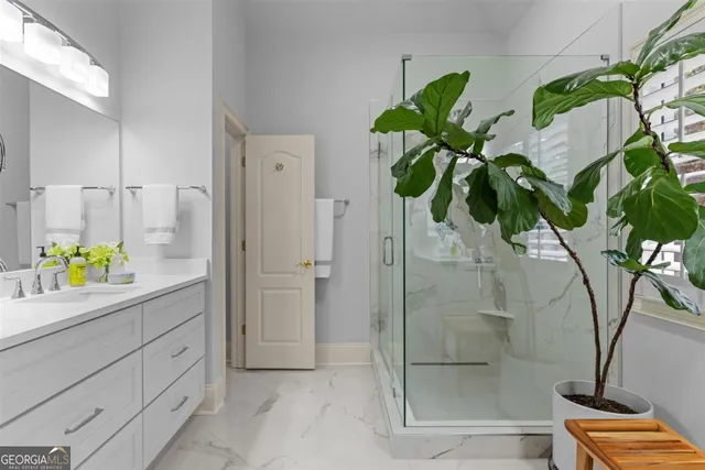 a view of walk in closet with clothes