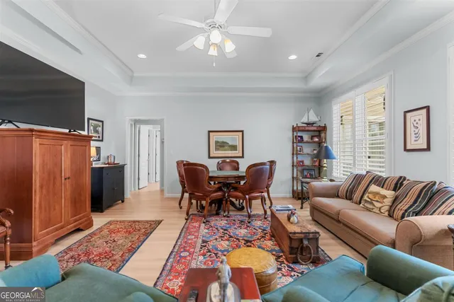 a living room with furniture potted plant and a window