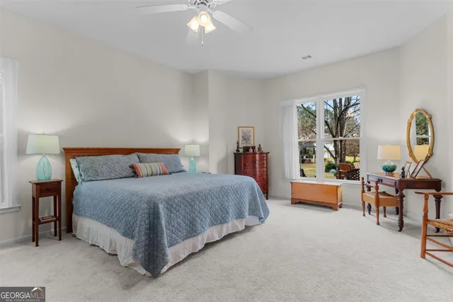 a spacious bathroom with a double vanity sink and a mirror