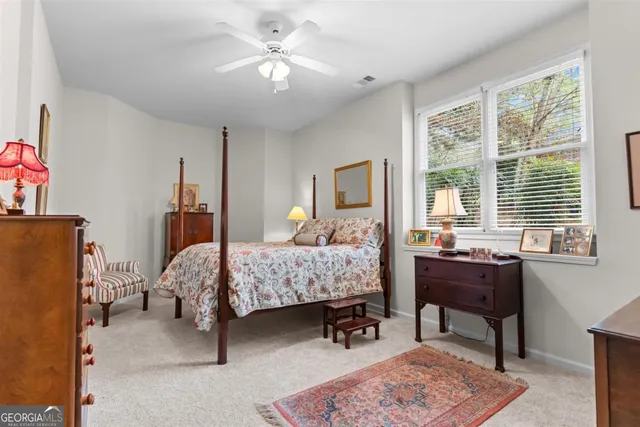 a bedroom with furniture and a wooden floor