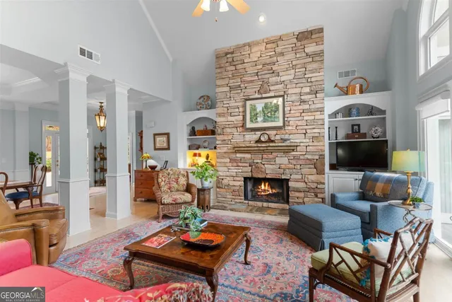 a living room with furniture and a fireplace