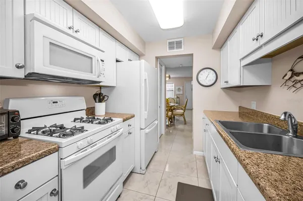 a kitchen with a stove and a microwave