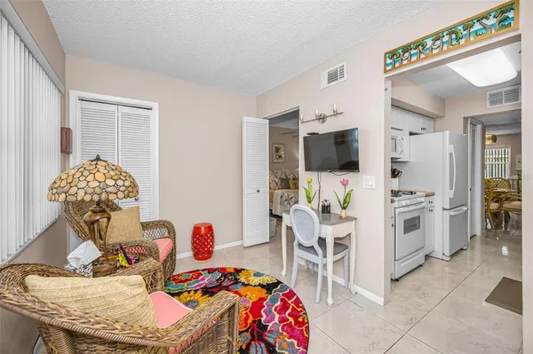 a bedroom with a bed and a lamp