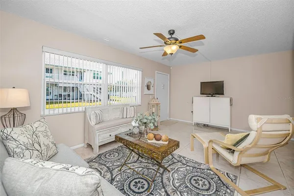 a living room with furniture and a window